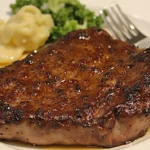 Perfectly Grilled Delmonico Steak recipe with Sizzling Butter and Herbs